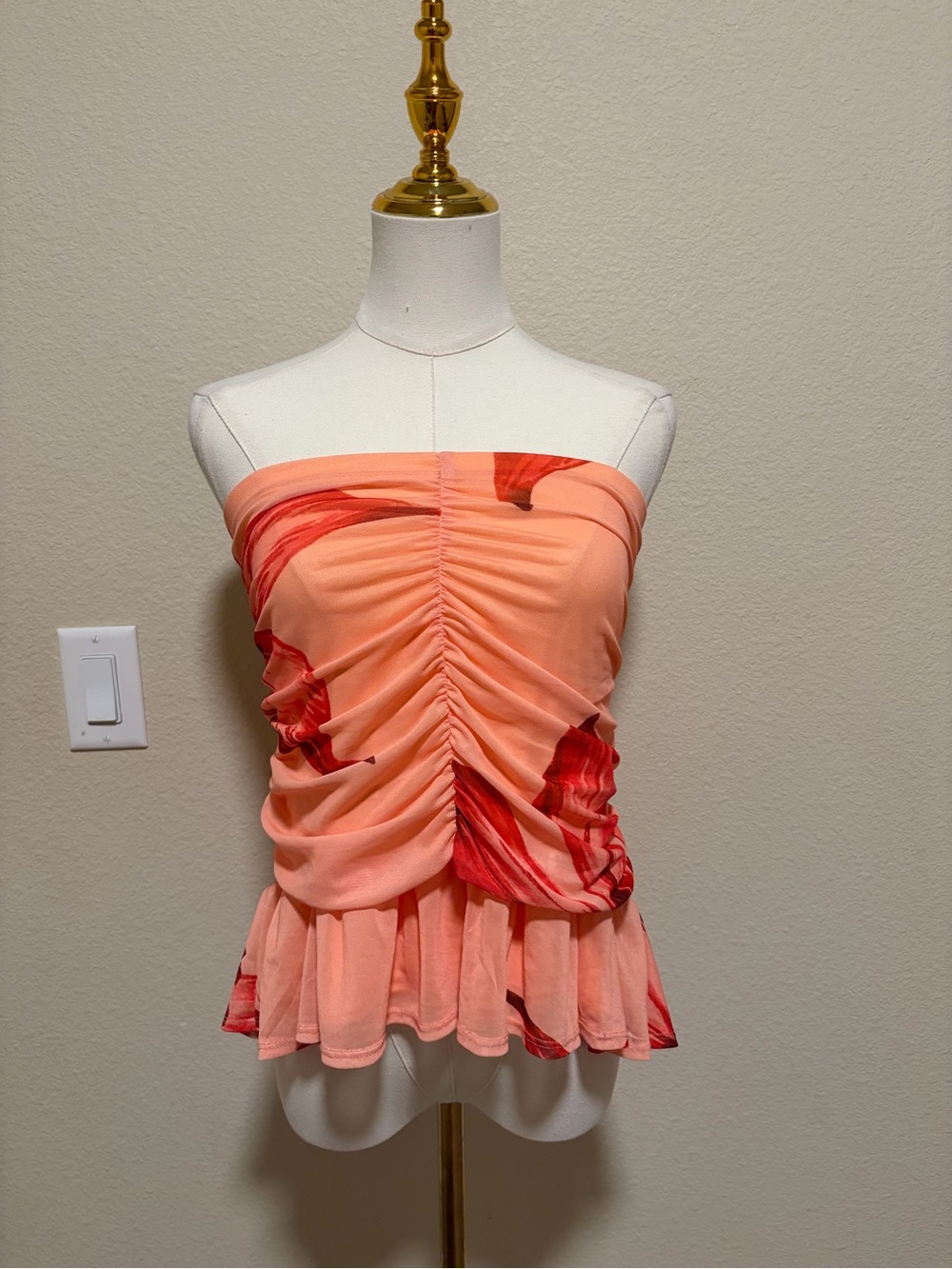 Sienna Sky Peach Strapless Ruched Peplum Top with Red Floral Accents